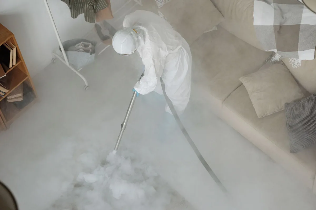 Biohazard cleanup technician in protective equipment, Cabool, MO